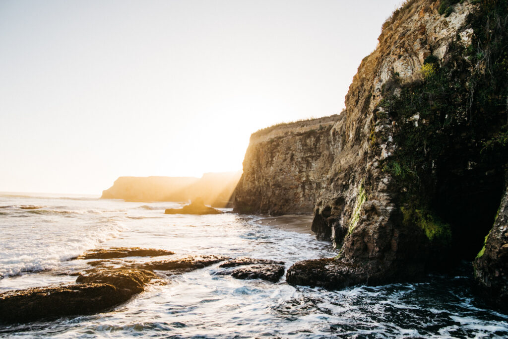 Rock cliffs overlooking the ocean at sunset on the North Coast off of Highway one