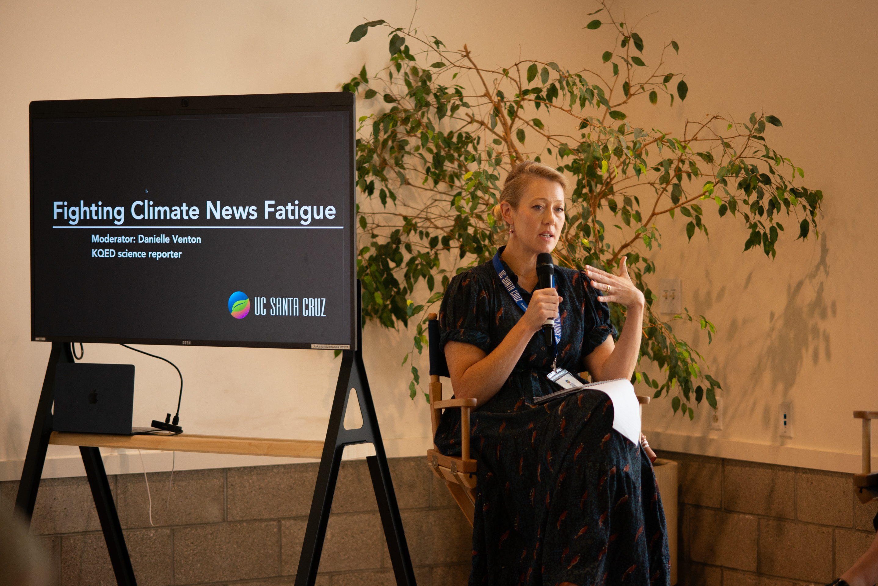 KQED science journalist Danielle Venton sitting on stage