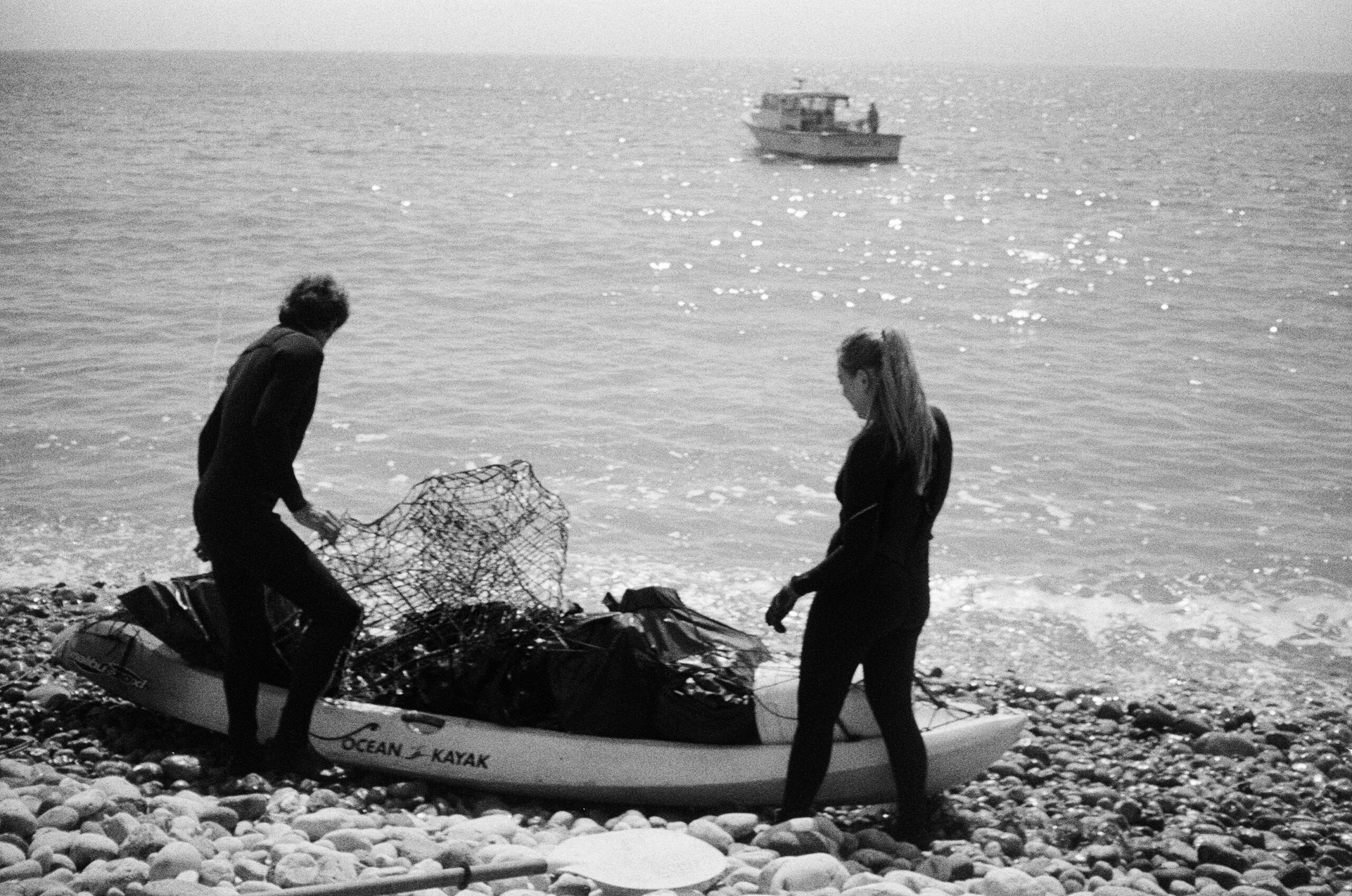 Fishers retrieving lost spiny lobster fishery gear off of Santa Cruz Island and returning to the fishing vessel offshore via kayak. Photo by M. DeCoite.