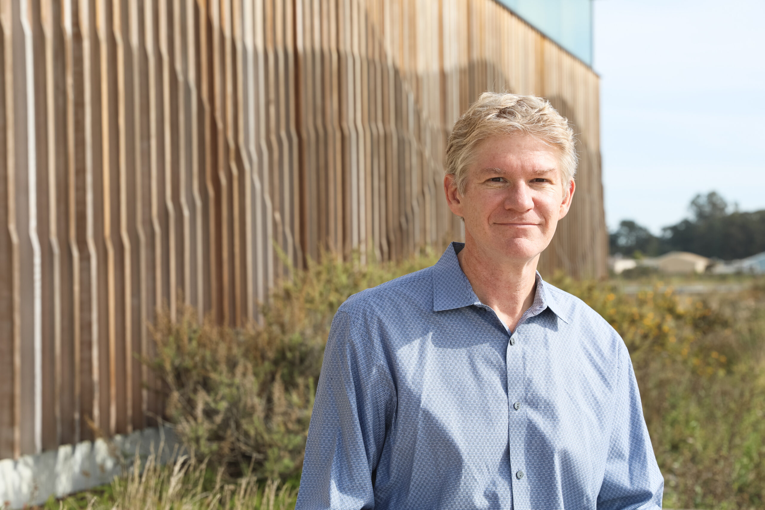 Portrait of Raphe Kudela outside at the Coastal Campus